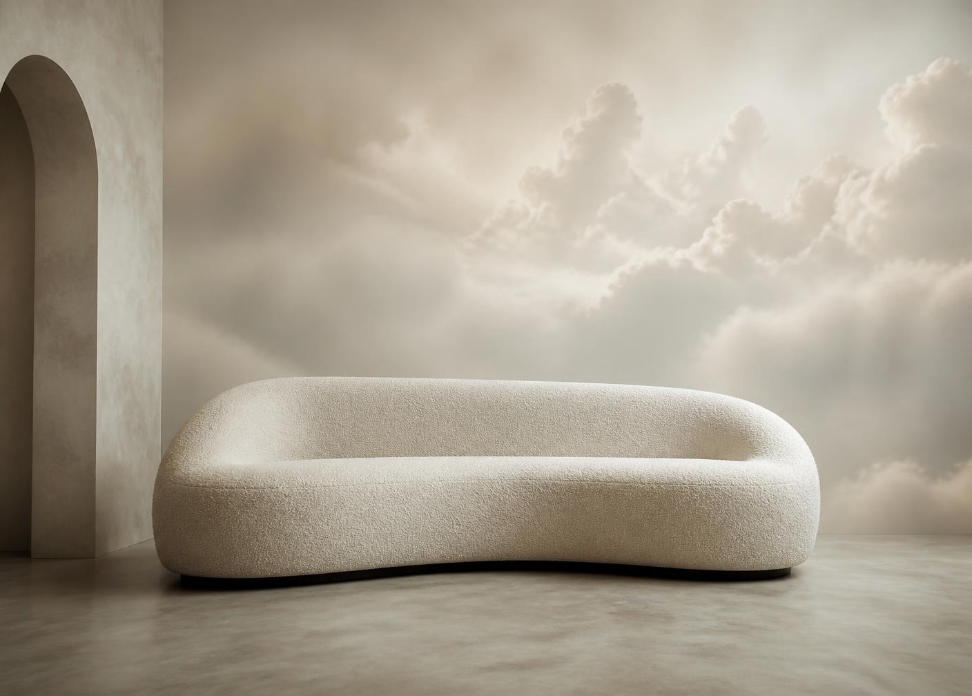 A sculptural sofa in a room where the walls continue into clouds